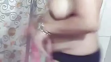 Beautiful MILF stripping in bathroom before nude bath